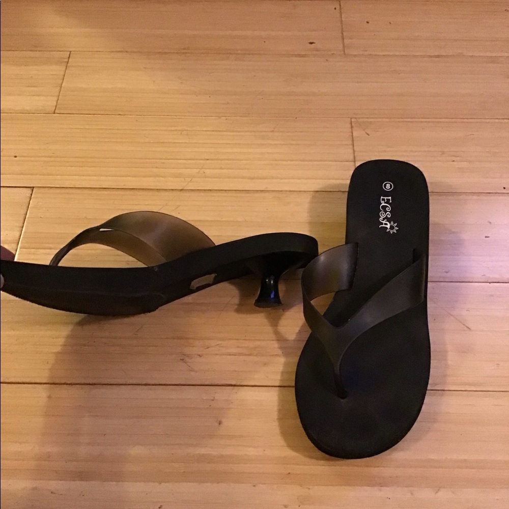 Black heeled flip flops